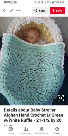 a crocheted baby blanket with a doll in it