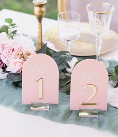 the table numbers are pink and gold