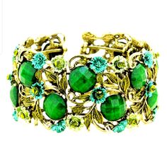 Stone Flower Leaf Cluster Evening Cuff Bracelet. Color: Antique Gold/Green Theme: Flower & Leaf Size: 1.25" H Adjustable Flower Crystal Bracelet For Spring, Adjustable Spring Crystal Bracelet With Flower Shape, Elegant Adjustable Crystal Bracelet For Spring, Spring Flower-shaped Adjustable Crystal Bracelet, Vintage Jewelry For Spring Party, Green Spring Party Jewelry, Spring Gift Bangle, Elegant Flower Shaped Crystal Bracelet For Spring, Metal Bangle As A Spring Season Gift