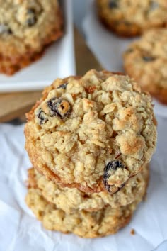 three oatmeal cookies stacked on top of each other with raisins