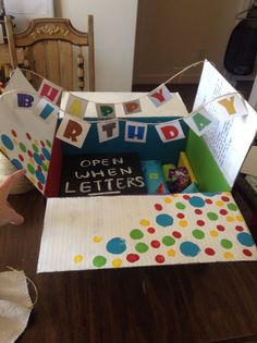 an open birthday letter box on a table