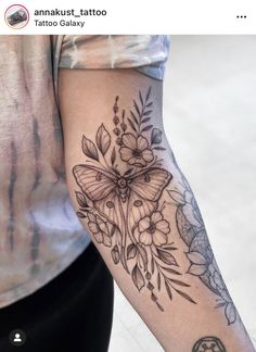 a person with a butterfly tattoo on their arm