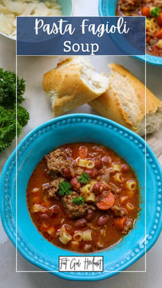 pasta fagioi soup in a blue bowl with bread on the side