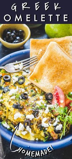 an egg omelette with olives, tomatoes and bread on the side in a blue bowl