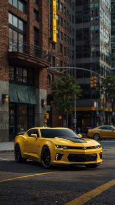 a yellow sports car is parked on the side of the road in front of tall buildings