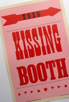 a pink and red poster with the words kissing booth on it