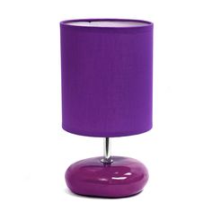 a purple lamp on a white background