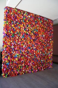 the wall is covered with colorful confetti