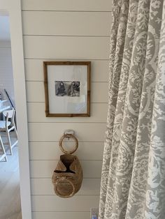 a bathroom with a sink, toilet and shower curtain