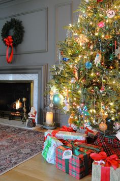 a decorated christmas tree with presents under it