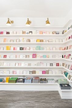 there are many books on the shelves in this room, and one is filled with them