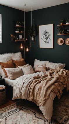 a bedroom with dark green walls and white bedding