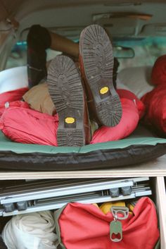 two pairs of shoes sitting in the back of a van