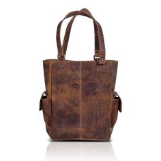 FULL GRAIN LEATHER- Each of our bags is handcrafted by experienced craftsmen and is made from full-grain water buffalo leather. The leather is thick and sturdy yet not rigid. SPACIOUS INTERIORS - Lined with high-end canvas the bag measures 14 inches high 11 inches wide 6 inches deep. This tote bag can fit a small laptop or Tablet With all your daily essentials. The bag also has a small magnetic closure strap. STORAGE - The bag has 1 interior zipper pocket, cellphone and pen pocket inside and has Oiled Leather Rectangular Satchel For Daily Use, Rectangular Oiled Leather Satchel For Daily Use, Daily Use Rectangular Oiled Leather Satchel, Brown Oiled Leather Shoulder Bag, Rugged Oiled Leather Rectangular Bag, Everyday Carry Textured Leather Brown Bag, Rugged Rectangular Shoulder Bag With Leather Lining, Rugged Rectangular Shoulder Bag For Everyday Carry, Rugged Soft Leather Bag For Daily Use