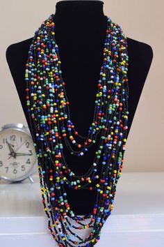 Unique African Maasai Handcrafted Beaded Necklace with an Elegant Look and Brilliant Finish. Circumference = 23 Inches / 60 Centimeters. Color = Multi color. **GET FREE SHIPPING FOR ADDITIONAL ITEMS PURCHASED. Yes, Buy Multiple Items and pay shipping for 1 item only- The rest ships Free. (No Limits on the number of Multiple items). With a faster delivery time of 3 days via DHLExpress, Worldwide. Ordinary/Standard Shipping also available upon request. We Custom Make to Suit Your Taste. Available Bohemian Multicolor Necklace With Black Beads, Multicolor Multi-strand Beaded Necklace With Black Beads, Spring Family Pictures, Purple Flame, Woman Necklace, Handmade Beaded Necklace, Witch Jewelry, Ethnic Necklaces, Handmade Beaded Necklaces