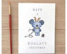 a card with a koalaty christmas design on it