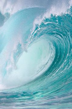 a large blue wave in the ocean