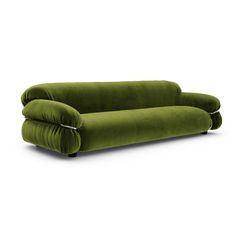 a green couch sitting on top of a white floor