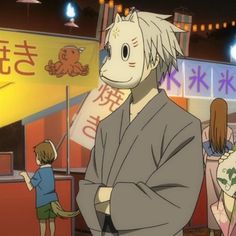 an anime character standing in front of a store with two children looking on at him