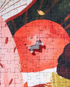 a piece of jigsaw puzzle with an image of a red umbrella on it