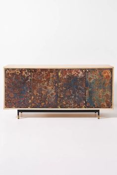 the sideboard is made out of metal and wood