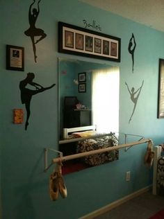 a bedroom with ballet themed wall decals on the walls