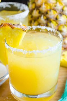 a pineapple margarita is garnished with sugar