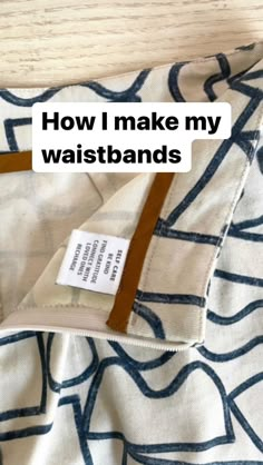 a white and blue blanket with a tag that says how i make my waistbands