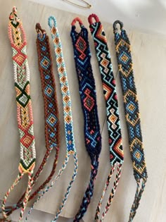 several bracelets are lined up on a table