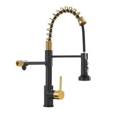 a kitchen faucet with gold spouting on the side and black handles