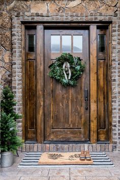 a wooden door with a wreath on it