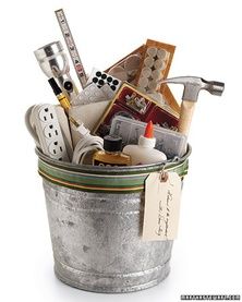 a bucket filled with lots of kitchen utensils