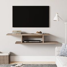 a flat screen tv mounted to the side of a wall