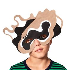 a young boy with a mask on his face