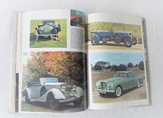 an open book with pictures of old cars