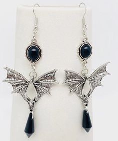 Make a bold fashion statement with these stunning Bat Drop Earrings. Their unique design and lightweight construction make them the perfect accessory to elevate any outfit. Whether you're dressing up for a night out or adding a touch of flair to your everyday look, these versatile earrings are a must-have for any fashion-forward individual. Add a touch of whimsy and style to your jewelry collection - get your Bat Drop Earrings today! Bat Wing Earrings, Bat Jewelry, Bohemian Style Jewelry, Bat Wing, Wing Earrings, Jewelry Inspo, Style Jewelry, Bold Fashion, Suncatchers