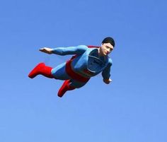 a man flying through the air while wearing a superman costume