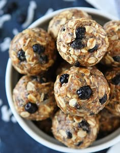 a bowl filled with oatmeal and raisins on top of a table