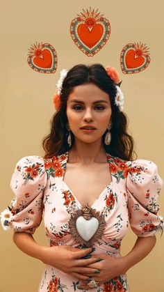 a woman in a pink dress with hearts above her head and an orange heart on top