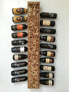 a wine rack with several bottles of wine on it and corks in the bottom