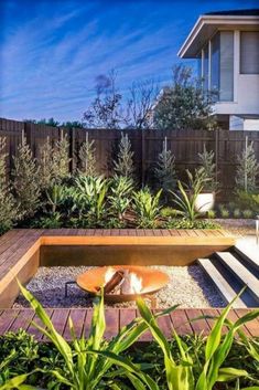 a wooden bench sitting in the middle of a garden