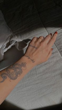 a woman's arm with a tattoo on it