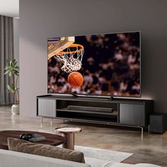 a living room with a basketball going through the hoop on it's television screen