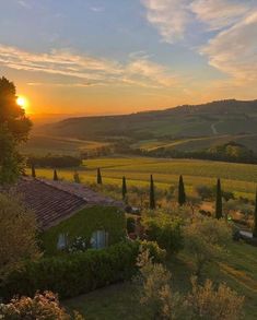 the sun is setting over an italian countryside