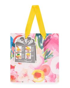 a colorful shopping bag with yellow handles is shown in front of a white background and has flowers on it