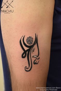 a tattoo on the arm of a man with an omen symbol in black ink