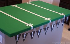 a green table with white lines on it