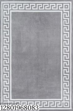 a gray rug with white greek border