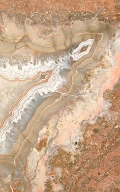 an aerial view of some rocks and water in the desert, looking down on them