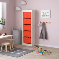 a child's room with pink walls and furniture